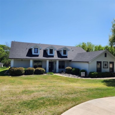Immaculate riverfront home with a gradual slope yard to the on Pecan Plantation Country Club in Texas - for sale on GolfHomes.com, golf home, golf lot