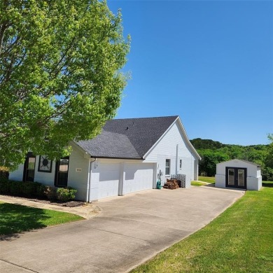 Immaculate riverfront home with a gradual slope yard to the on Pecan Plantation Country Club in Texas - for sale on GolfHomes.com, golf home, golf lot