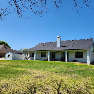 Immaculate riverfront home with a gradual slope yard to the on Pecan Plantation Country Club in Texas - for sale on GolfHomes.com, golf home, golf lot