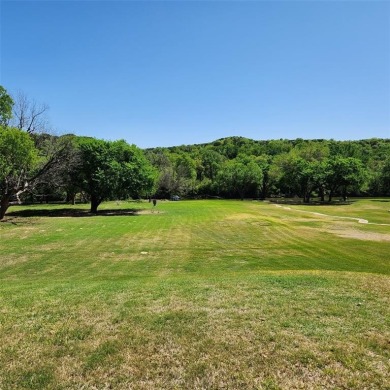Immaculate riverfront home with a gradual slope yard to the on Pecan Plantation Country Club in Texas - for sale on GolfHomes.com, golf home, golf lot