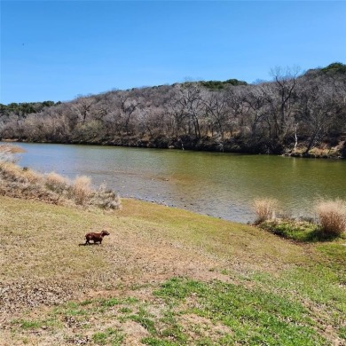 Immaculate riverfront home with a gradual slope yard to the on Pecan Plantation Country Club in Texas - for sale on GolfHomes.com, golf home, golf lot