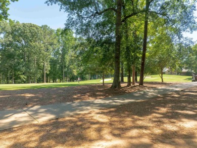 Nestled amidst the tranquil beauty of the prestigious Jack on Great Waters Course At Reynolds Plantation in Georgia - for sale on GolfHomes.com, golf home, golf lot