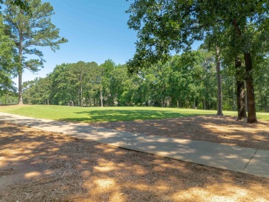 Nestled amidst the tranquil beauty of the prestigious Jack on Great Waters Course At Reynolds Plantation in Georgia - for sale on GolfHomes.com, golf home, golf lot