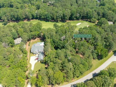 Nestled amidst the tranquil beauty of the prestigious Jack on Great Waters Course At Reynolds Plantation in Georgia - for sale on GolfHomes.com, golf home, golf lot