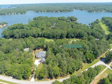 Nestled amidst the tranquil beauty of the prestigious Jack on Great Waters Course At Reynolds Plantation in Georgia - for sale on GolfHomes.com, golf home, golf lot