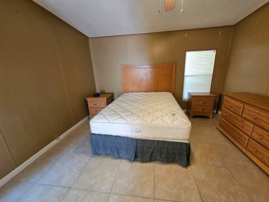 This home is on leased land in Cypress Lakes Village (a 55+ on Big Cypress Golf and Country Club in Florida - for sale on GolfHomes.com, golf home, golf lot