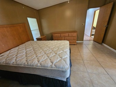 This home is on leased land in Cypress Lakes Village (a 55+ on Big Cypress Golf and Country Club in Florida - for sale on GolfHomes.com, golf home, golf lot