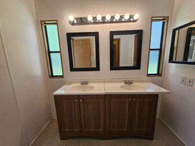 This home is on leased land in Cypress Lakes Village (a 55+ on Big Cypress Golf and Country Club in Florida - for sale on GolfHomes.com, golf home, golf lot