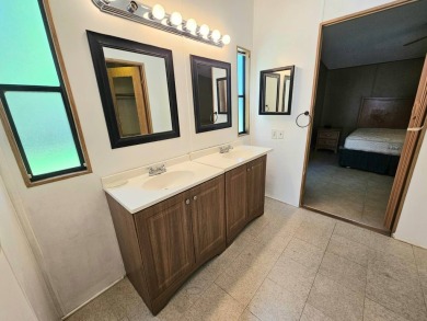 This home is on leased land in Cypress Lakes Village (a 55+ on Big Cypress Golf and Country Club in Florida - for sale on GolfHomes.com, golf home, golf lot