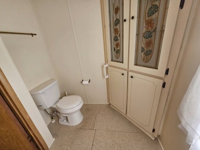This home is on leased land in Cypress Lakes Village (a 55+ on Big Cypress Golf and Country Club in Florida - for sale on GolfHomes.com, golf home, golf lot