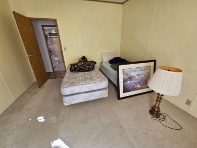This home is on leased land in Cypress Lakes Village (a 55+ on Big Cypress Golf and Country Club in Florida - for sale on GolfHomes.com, golf home, golf lot