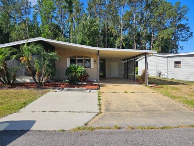 This home is on leased land in Cypress Lakes Village (a 55+ on Big Cypress Golf and Country Club in Florida - for sale on GolfHomes.com, golf home, golf lot