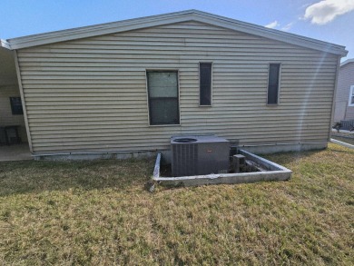 This home is on leased land in Cypress Lakes Village (a 55+ on Big Cypress Golf and Country Club in Florida - for sale on GolfHomes.com, golf home, golf lot