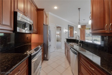 Pristine, remodeled, and ready for you... this Ibis II pool home on Herons Glen Golf and Country Club in Florida - for sale on GolfHomes.com, golf home, golf lot