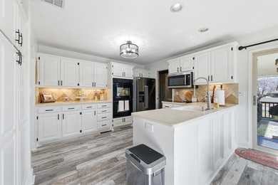 Spectacular, totally updated Reflection Ridge ranch with a on Reflection Ridge Golf Club in Kansas - for sale on GolfHomes.com, golf home, golf lot