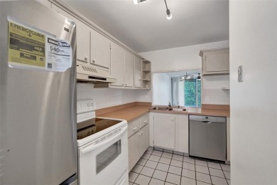 Experience resort-style living in this spacious 2-bedroom on Pine Island Ridge Country Club in Florida - for sale on GolfHomes.com, golf home, golf lot