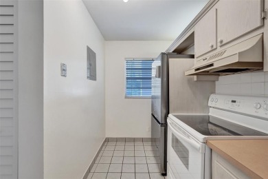 Experience resort-style living in this spacious 2-bedroom on Pine Island Ridge Country Club in Florida - for sale on GolfHomes.com, golf home, golf lot