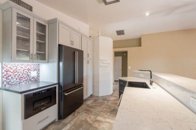 Welcome to this meticulously updated home in the Cove, located on Voyager RV Resort and Golf Course in Arizona - for sale on GolfHomes.com, golf home, golf lot