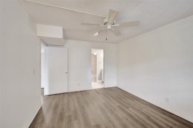 Experience resort-style living in this spacious 2-bedroom on Pine Island Ridge Country Club in Florida - for sale on GolfHomes.com, golf home, golf lot