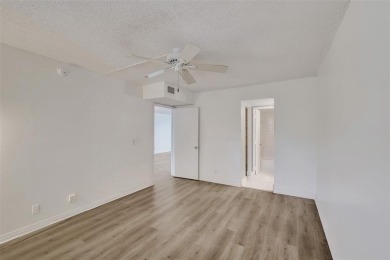 Experience resort-style living in this spacious 2-bedroom on Pine Island Ridge Country Club in Florida - for sale on GolfHomes.com, golf home, golf lot