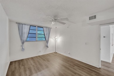 Experience resort-style living in this spacious 2-bedroom on Pine Island Ridge Country Club in Florida - for sale on GolfHomes.com, golf home, golf lot