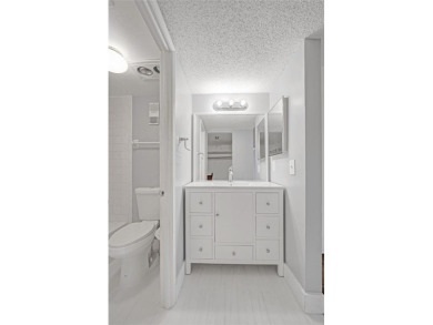 Experience resort-style living in this spacious 2-bedroom on Pine Island Ridge Country Club in Florida - for sale on GolfHomes.com, golf home, golf lot