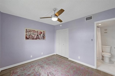 Experience resort-style living in this spacious 2-bedroom on Pine Island Ridge Country Club in Florida - for sale on GolfHomes.com, golf home, golf lot