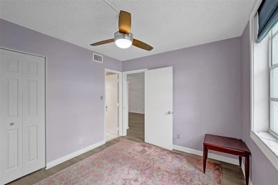Experience resort-style living in this spacious 2-bedroom on Pine Island Ridge Country Club in Florida - for sale on GolfHomes.com, golf home, golf lot