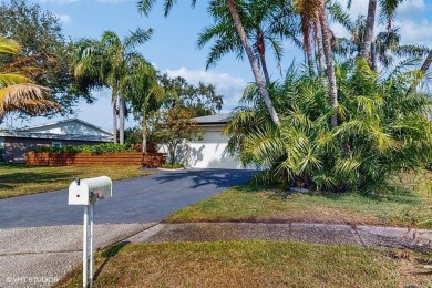 Stunning Pool Home in a Tranquil Cul-de-Sac. This beautifully on Countryside Country Club in Florida - for sale on GolfHomes.com, golf home, golf lot