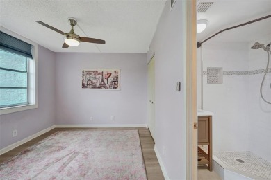 Experience resort-style living in this spacious 2-bedroom on Pine Island Ridge Country Club in Florida - for sale on GolfHomes.com, golf home, golf lot