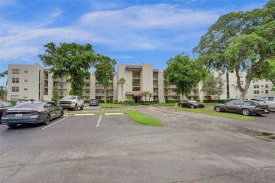 Experience resort-style living in this spacious 2-bedroom on Pine Island Ridge Country Club in Florida - for sale on GolfHomes.com, golf home, golf lot