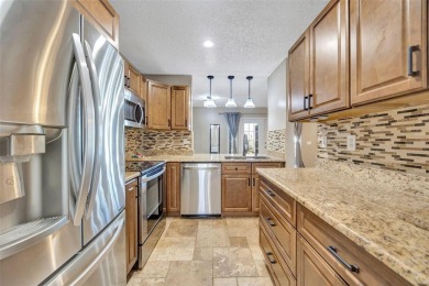 Welcome to this beautifully updated 2-bedroom, 2.5-bath townhome on Northdale Golf and Tennis Club in Florida - for sale on GolfHomes.com, golf home, golf lot