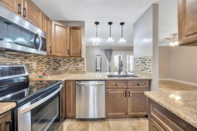 Welcome to this beautifully updated 2-bedroom, 2.5-bath townhome on Northdale Golf and Tennis Club in Florida - for sale on GolfHomes.com, golf home, golf lot