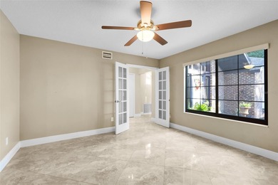 Not your cookie-cutter home.  This lovely Tudor offers character on Orange Tree Golf Club in Florida - for sale on GolfHomes.com, golf home, golf lot