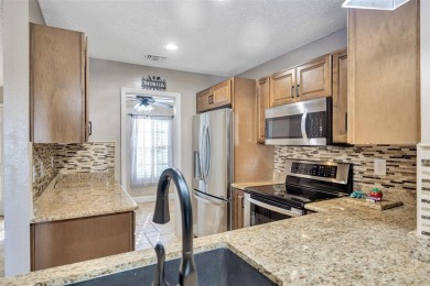 Welcome to this beautifully updated 2-bedroom, 2.5-bath townhome on Northdale Golf and Tennis Club in Florida - for sale on GolfHomes.com, golf home, golf lot