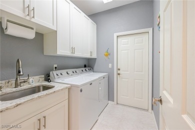 Modern comfort meets timeless charm in this exceptional on Herons Glen Golf and Country Club in Florida - for sale on GolfHomes.com, golf home, golf lot