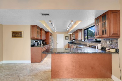 Not your cookie-cutter home.  This lovely Tudor offers character on Orange Tree Golf Club in Florida - for sale on GolfHomes.com, golf home, golf lot