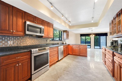 Not your cookie-cutter home.  This lovely Tudor offers character on Orange Tree Golf Club in Florida - for sale on GolfHomes.com, golf home, golf lot