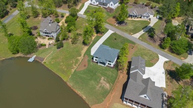 THIS GORGEOUS NEW CONSTRUCTION IS DIRECTLY ON OSPREY POINTE POND on Harbor Club Golf and Country Club in Georgia - for sale on GolfHomes.com, golf home, golf lot