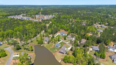 THIS GORGEOUS NEW CONSTRUCTION IS DIRECTLY ON OSPREY POINTE POND on Harbor Club Golf and Country Club in Georgia - for sale on GolfHomes.com, golf home, golf lot