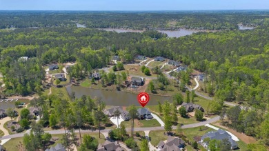 THIS GORGEOUS NEW CONSTRUCTION IS DIRECTLY ON OSPREY POINTE POND on Harbor Club Golf and Country Club in Georgia - for sale on GolfHomes.com, golf home, golf lot