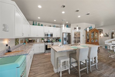 Beautiful home located in the gated community of The Enclave at on Laughlin Ranch Golf Club in Arizona - for sale on GolfHomes.com, golf home, golf lot