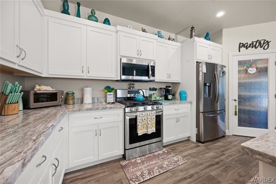 Beautiful home located in the gated community of The Enclave at on Laughlin Ranch Golf Club in Arizona - for sale on GolfHomes.com, golf home, golf lot