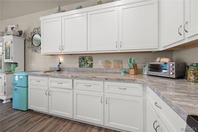 Beautiful home located in the gated community of The Enclave at on Laughlin Ranch Golf Club in Arizona - for sale on GolfHomes.com, golf home, golf lot