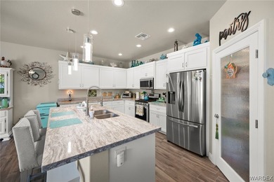 Beautiful home located in the gated community of The Enclave at on Laughlin Ranch Golf Club in Arizona - for sale on GolfHomes.com, golf home, golf lot