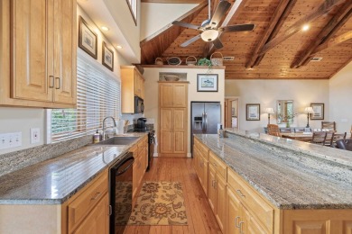 Experience breathtaking lake views from this charming 3-bedroom on The Golf Club at Cuscowilla in Georgia - for sale on GolfHomes.com, golf home, golf lot