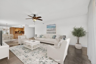 SPACIOUS FIRST FLOOR CORNER UNIT FILLED WITH NATURAL LIGHT on BallenIsles Golf and Country Club in Florida - for sale on GolfHomes.com, golf home, golf lot