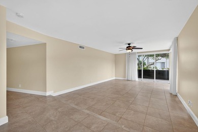 SPACIOUS FIRST FLOOR CORNER UNIT FILLED WITH NATURAL LIGHT on BallenIsles Golf and Country Club in Florida - for sale on GolfHomes.com, golf home, golf lot