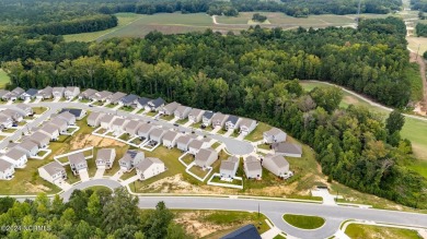 Welcome to this exceptional 5-bedroom, 3-bathroom home located on The Golf Club At Rocky Mount in North Carolina - for sale on GolfHomes.com, golf home, golf lot