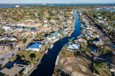 Tucked behind the private gates of the Bay Point community, this on Bay Point Resort Golf Club in Florida - for sale on GolfHomes.com, golf home, golf lot
